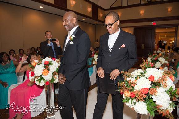 Groom and officiant during the processional