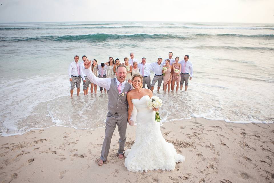 Wedding party pose on the beach