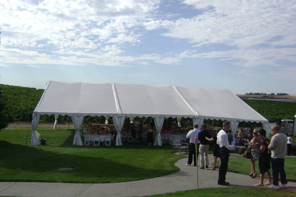 Placement of tents uses the layout of the property to make the event flow from one area to another.