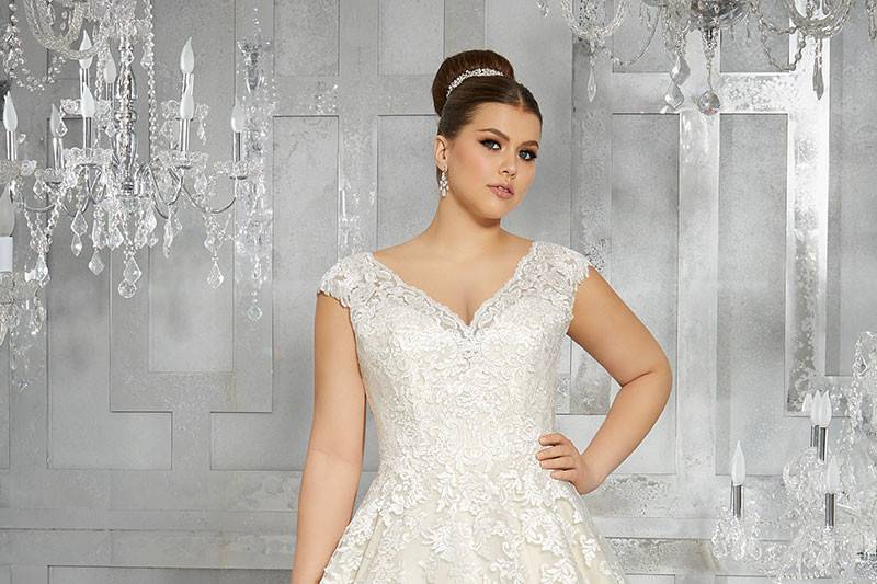 Moiselle, Style 3228	Breathtaking and Timeless, this Tulle Bridal Ball Gown Features Frosted, Embroidered Appliqués and an Off-the-Shoulder V-Neckline with Cap Sleeves. Colors Available: White, Ivory, Ivory/Light Gold.