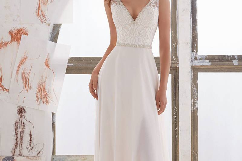 Marjorie, Style 5505	Simply and Elegant, This Georgette Sheath Gown Features an Embroidered Bodice with Illusion Side Insets and Crystal Beaded Trim. Deep V Neckline and Back. Colors Available: Diamond White, Ivory/Nude.