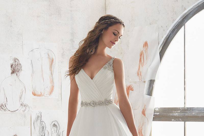 Marlowe, Style 5507	This Organza Ballgown Combines a Traditional A- Line Silhouette with Modern Details. Diamante Beading on Straps and Keyhole Back. Removable Belt. Available in: White/Silver, Ivory/Blush/Silver.