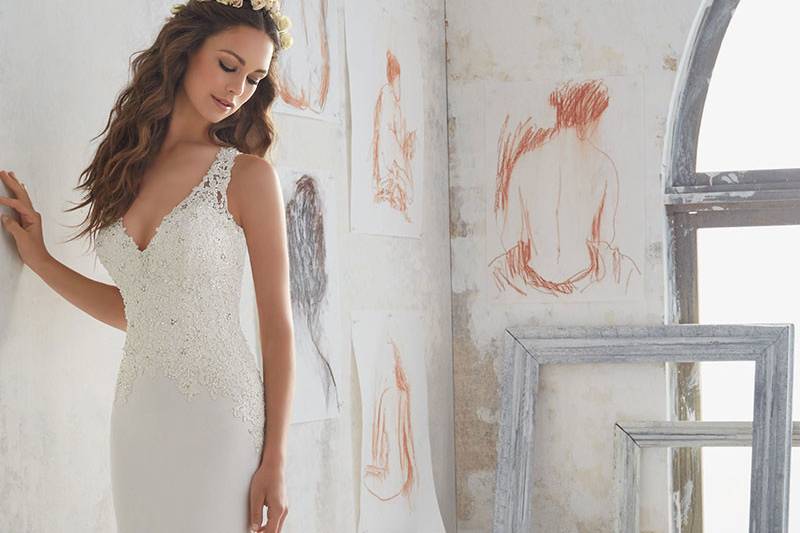 Marquita, Style 5508	A Fresh Take on a Classic Crepe Sheath Wedding Dress. Crystal Beaded Alençon Lace Appliqués Accent the Bodice and Open Keyhole Back. Colors Available: White, Ivory. Shown in Ivory.