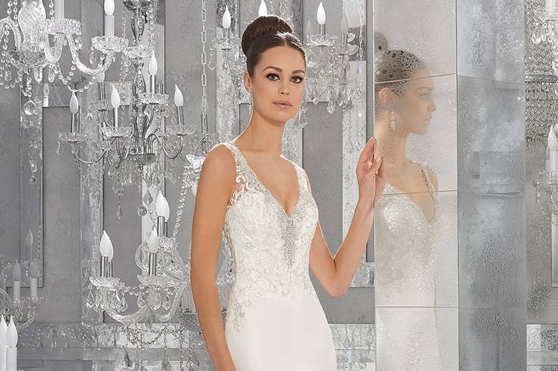 Myka, Style 5564	Elegant Silky Chiffon Wedding Dress Featuring Diamanté Beaded Embroidery and Lace Appliqués. Deep-V Neckline and Illusion Back. Covered Button Detail on Back. Available: in White and Ivory.