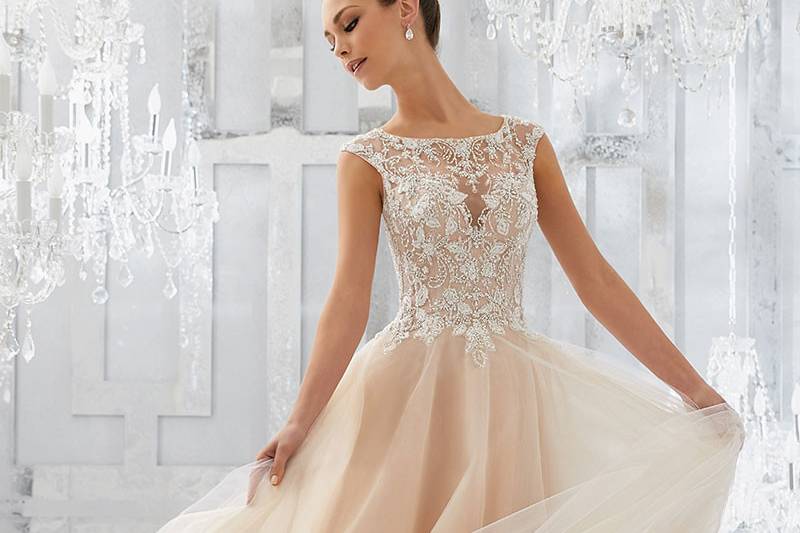 Mirella, Style 5567	Feminine and Dreamy, This Soft Tulle Bridal Ballgown Features an Intricate Bodice with Crystal Beaded Embroidery and Beautiful Keyhole Back. Colors Available: White, Ivory, Ivory/Light Gold.