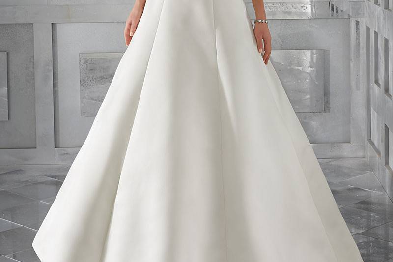 Malke, Style 5574	Simple and Elegant, This Duchess Satin A-Line V Neck Bridal Gown Features Diamanté Beaded Embroidery Along the Shoulders and Down the Open Back. Colors Available: White/Silver , Ivory/Silver.