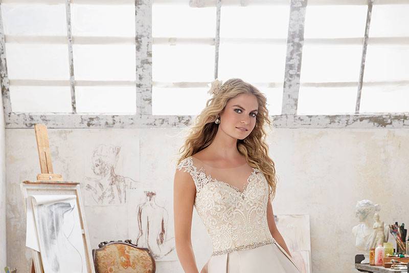 Maclaine, Style 8103	A-Line Wedding Dress Features Frosted, Embroidered Applique?s on Net with Duchess Satin Skirt. Crystal Beading Trims the Waistline. Illusion Back. Available in: White, Ivory, Champagne.