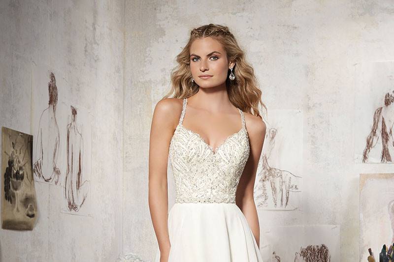 Maelani, Style 8106	Diamant?e Beaded Bodice Perfectly Complements this Silky Chiffon Skirt. Removable Beaded Organza Belt Included (Also Sold Separately as Style #11252). Colors Available: White/Silver, Ivory/Silver.