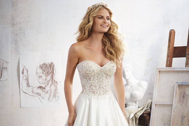 Mara, Style 8114	Crystal Beaded Embroidery Accents this Corset Style Net Over Chantilly Lace Sweetheart Bodice. Duchess Satin Skirt. Crystal Button Detail Along Back. Colors Available: White, Ivory, Nude.