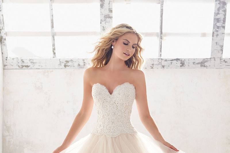 Marcia, Style 8116	Soft and Ethereal, This Ruffled Bridal Ballgown Features a Crystal Beaded Alen?çon Lace Bodice, and Horsehair Trimmed Flounced Tulle Skirt. Available in: White, Ivory, Champagne.
