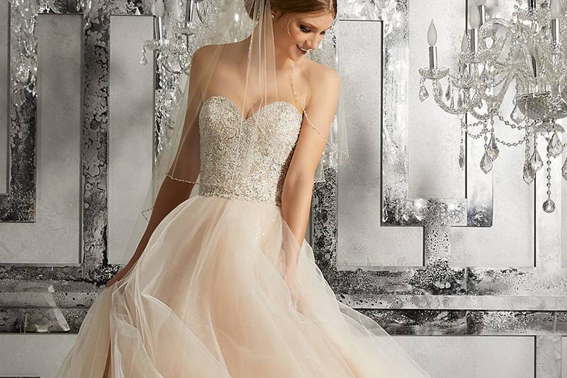 Mystique, Style 8175	Fit for a Fairytayle, This Beautiful Bridal Ballgown Features a Diamanté & Crystal Beaded Embroidered Sweetheart Bodice & full Tulle Skirt Over Sparkly Sequined Net. Available in: White, Ivory, Nude.