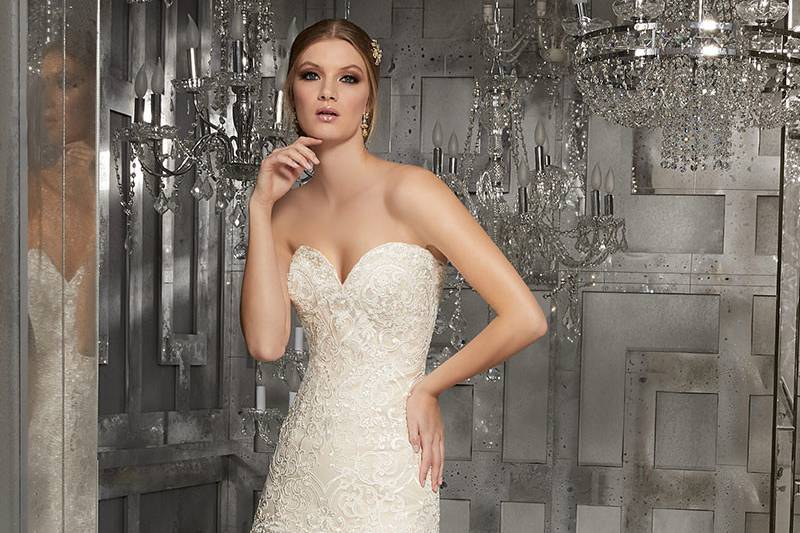 Monroe, Style 8178	Lavish Sweetheart Neckline A-Line Gown with Sculptured, Re-Embroidered Lace and Scalloped Hemline on a Gorgeous Lace Train. Colors Available: White, Ivory, Ivory/Champagne.