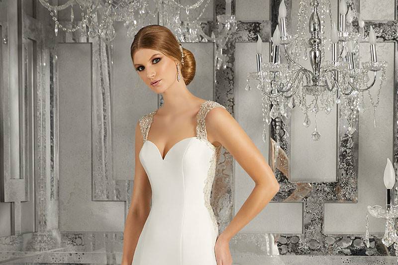 Meranda, Style 8181	This Sleek A -Line Sweetheart Neckline Marcella Satin Wedding Dress Features Intricate Crystal Beaded, Embroidred Straps and Heyhole Back Detail. Colors Available: White/Silver, Ivory/Silver.