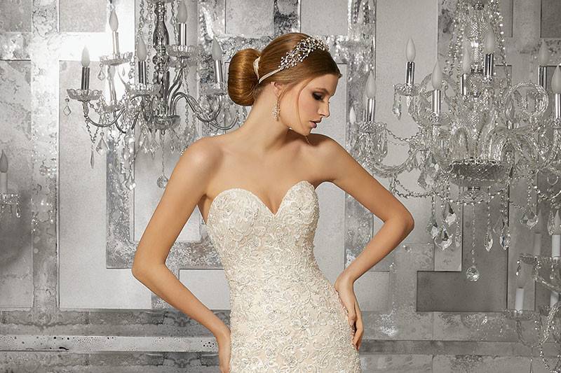 Mirjana, Style 8189	Glamorous Sweetheart Neckline Mermaid Wedding Gown Featuring Crystal Beaded, Embroidered Lace Appliqués and a Circular Flounced Organza Skirt. Colors Available: White, Ivory, Ivory/Light Gold.