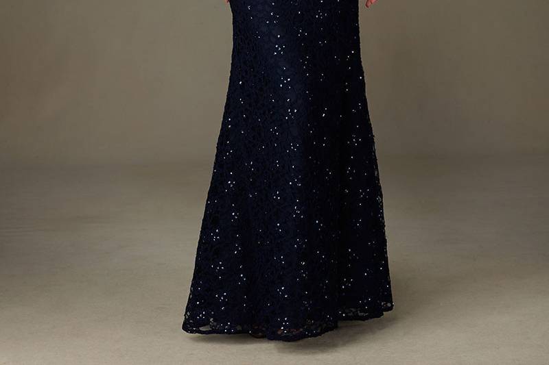 Style 121	Spectacular Long Beaded Lace Bridesmaid Dress with Cap Sleeves. V Back. Designed by Madeline Gardner. Matching Tie Sash included. Shown in Navy.