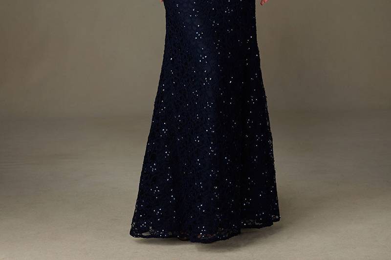 Style 121		Spectacular Long Beaded Lace Bridesmaid Dress with Cap Sleeves.  V Back.  Designed by Madeline Gardner. Matching Tie Sash included. Shown in Navy.