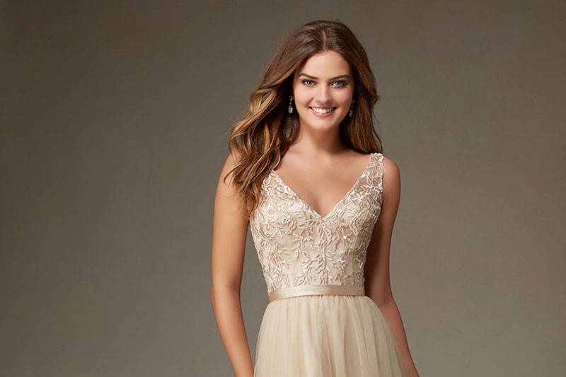 Style 134		Long Flowy Tulle Morilee Bridesmaid Dress with Embroidery and Beading with Satin Waistband.  High Illusion Jewel Neck meeting thin Criss Cross straps in the back.  Available in 11 colors.