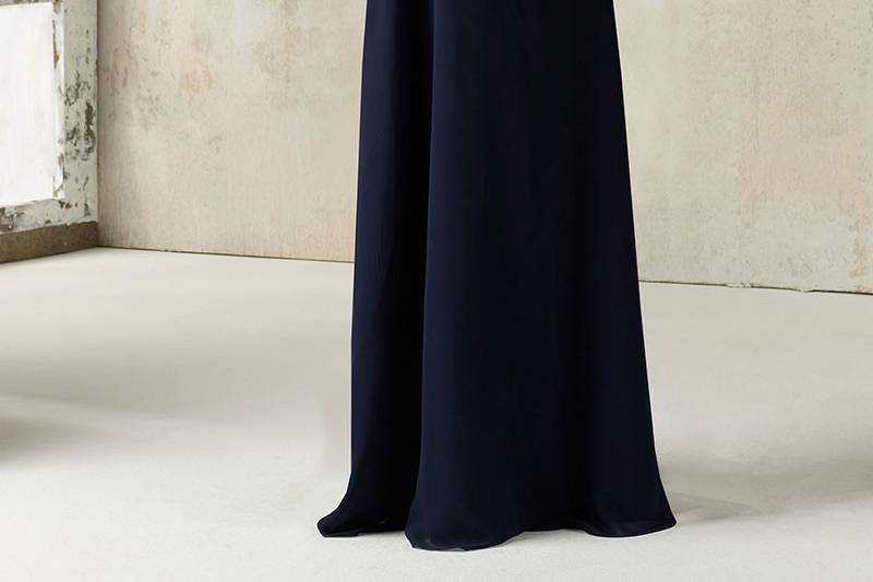 Style 21527		This Stunning Chiffon Bridesmaids Dress Features a Romantic Ruffled V Neckline and Open Keyhole Back. Zipper Back. Shown in Navy. Available in 34 colors.