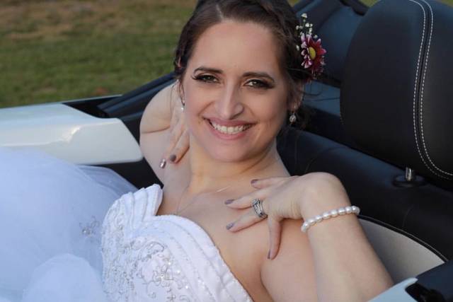 Pamela in her beautiful dress on her way to reception in her convertible car.