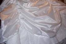 This Christening gown set was designed from the Jessica Mcclintock wedding gown pictured. As you can see the essential details of the original gown have been carried through to the redesign.