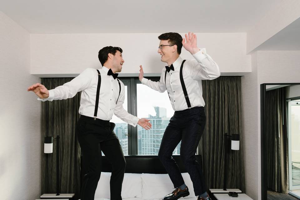 Grooms jumping on the bed!