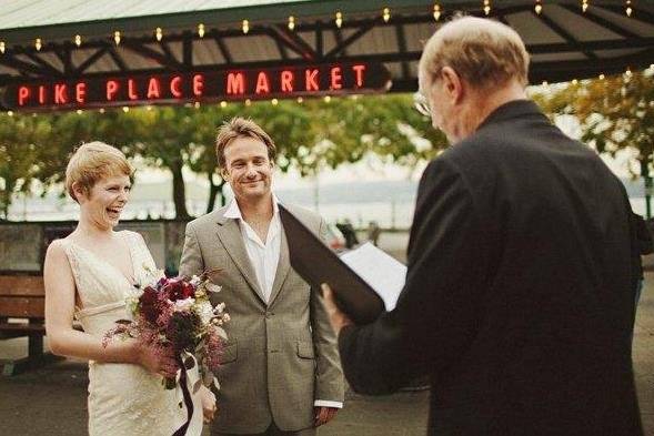 Couple being wed at Pike Place Market