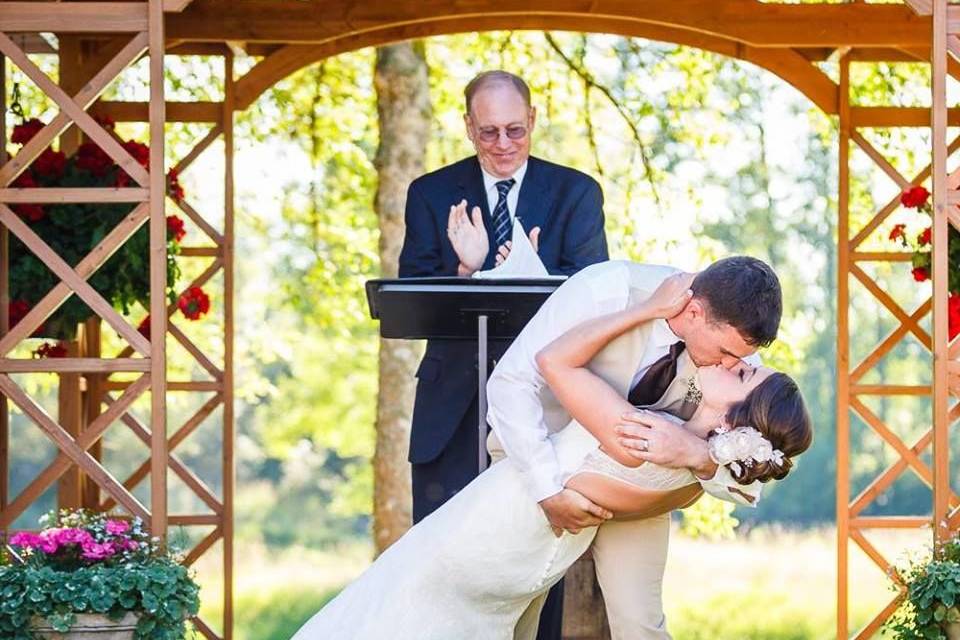 Groom dipping the bride for a kiss