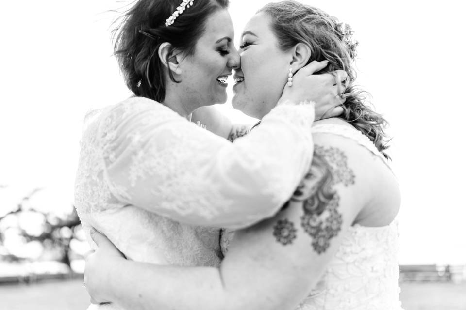 Brides about to kiss