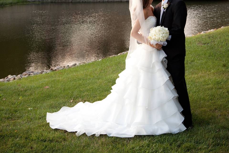 Bride & Groom and wedding party by the stone bridge