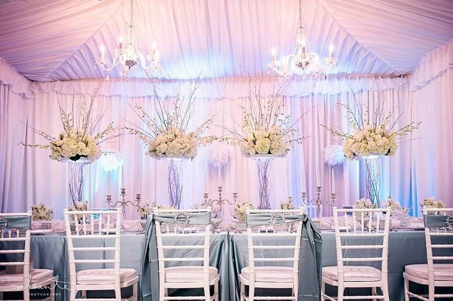 Head table and raised floral centerpieces