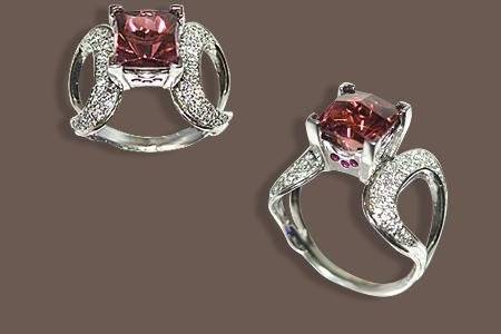 Graceful & glittering 18k white gold ring features a 3.59 carat pink tourmaline exotically cut in Idar-Oberstein, Germany. 6 rubies total 0.09 carats in the front & back of the tourmaline setting. 48 diamonds shimmer total 0.44 carats as you move your hand.