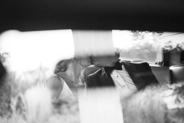 Bride and groom in car