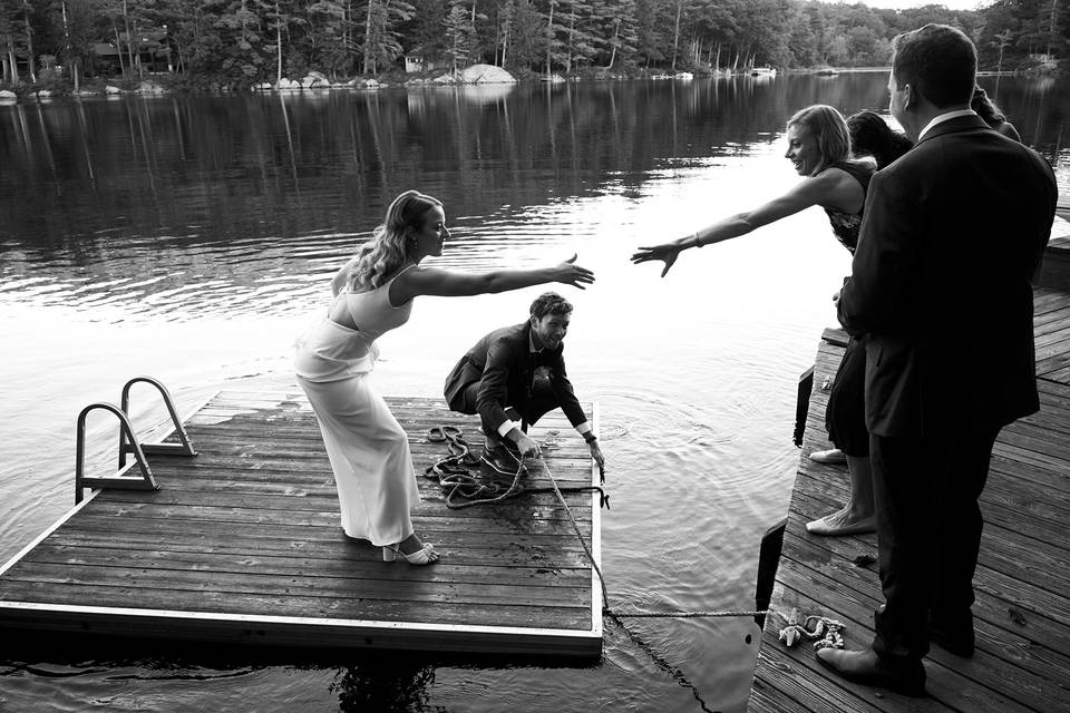 Bride and groom on dock