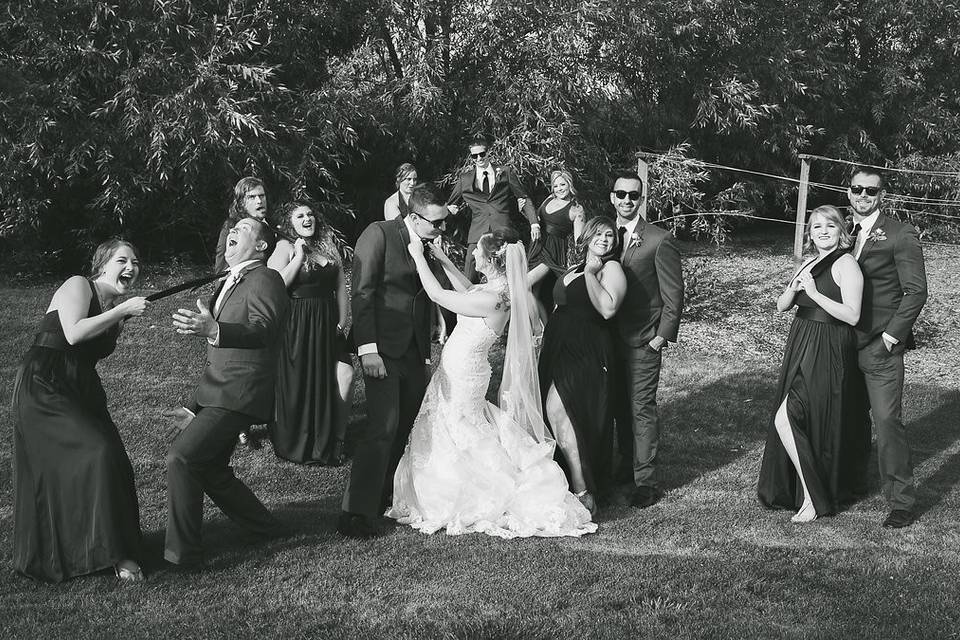 The couple with the bridesmaids and groomsmen