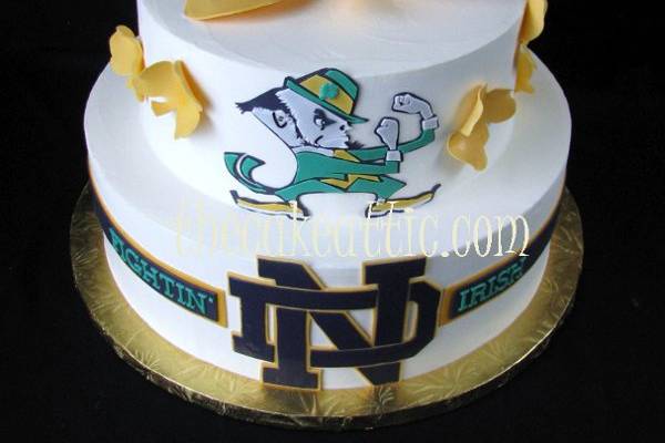 Buttercream cake with all sugar decorations for a Notre Dame fan.