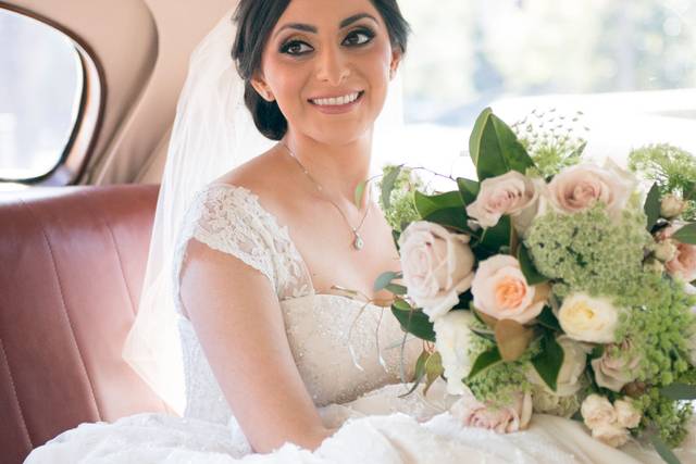 Stunning bride in her vintage limo