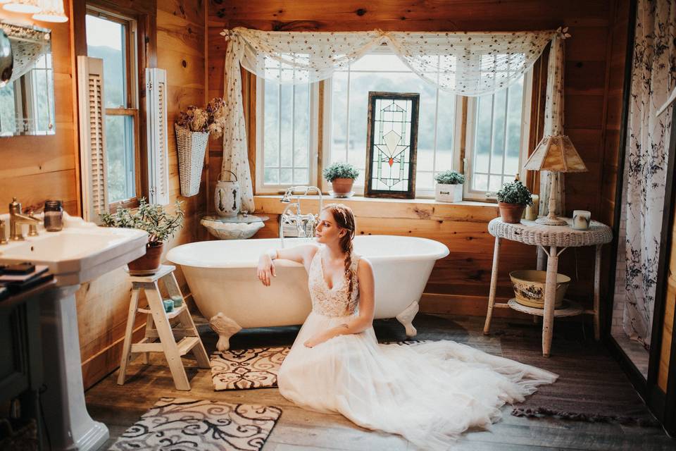 Bride sitting by the tub