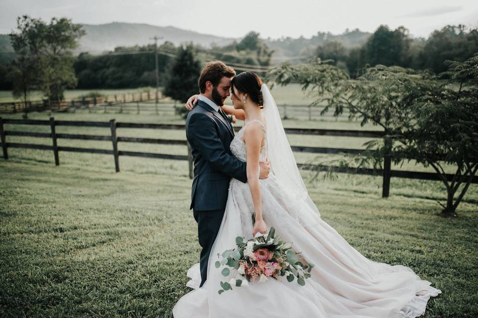 Groom embraces his bride