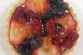 Mini fruit tart with raspberries, strawberries, and blueberries