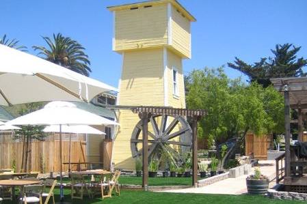 An antique water wheel creates the perfect focal point for cocktail area and a photo opportunity.