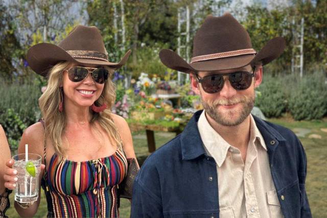 Couple showing off their hats