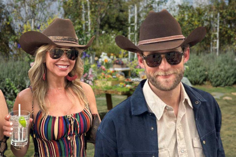 Couple showing off their hats