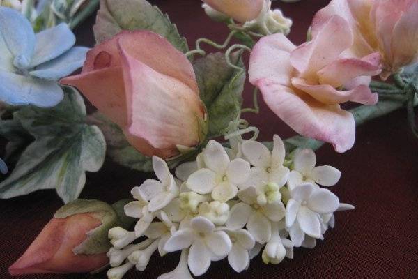 Closeup of Hand-made Sugar Roses, Lilacs, and Hydrangea