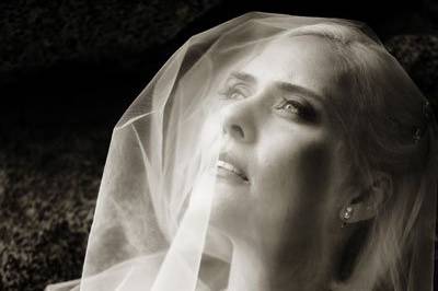 The bride's cathedral length veil was gorgeous during her portraits at The Ahwahnee Hotel following her ceremony.