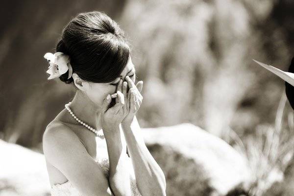 The bride's reaction during her vows at Glacier Point in Yosemite, where the Groom serenaded her during their ceremony.