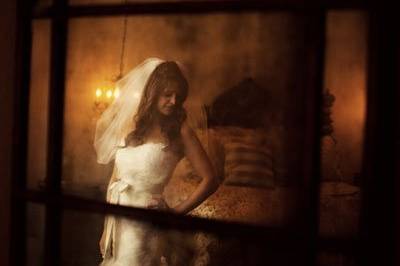 This image was shot as a reflection in the bride's antique mirror.