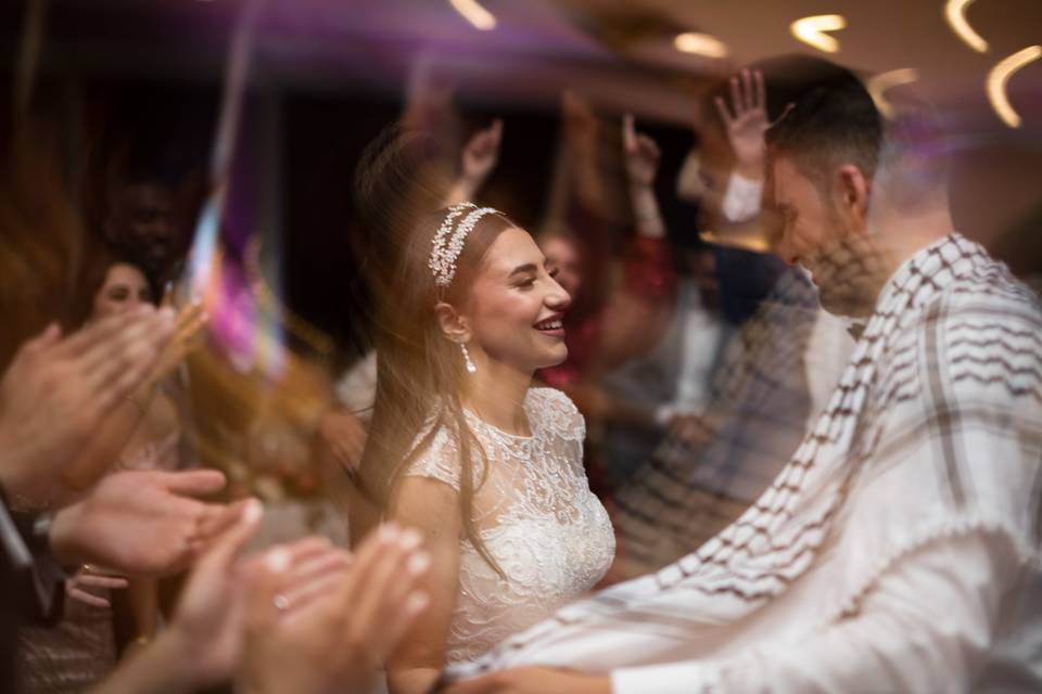 Bride dancing with groom.