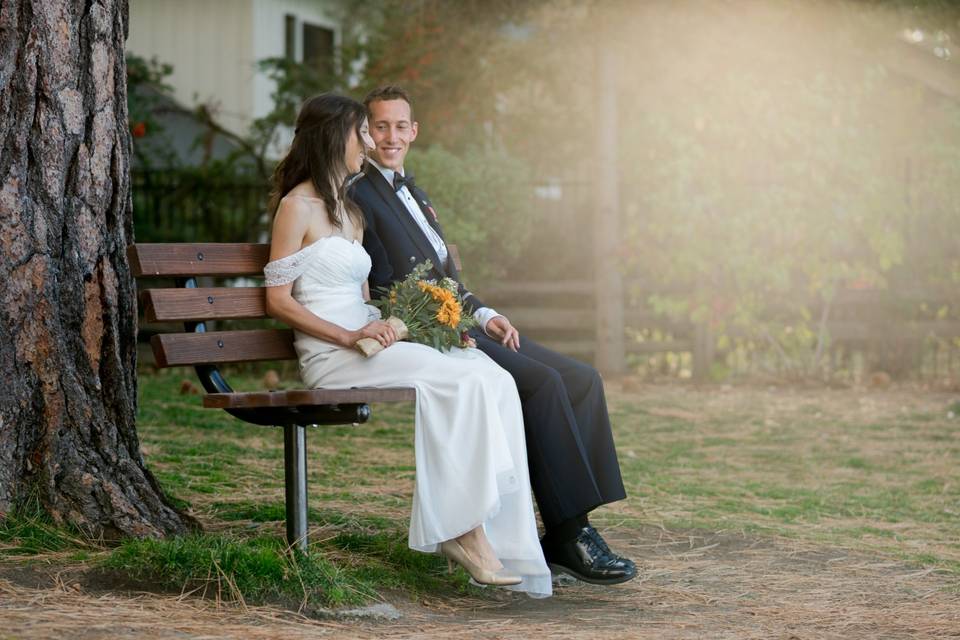 Couple sitting on bench.