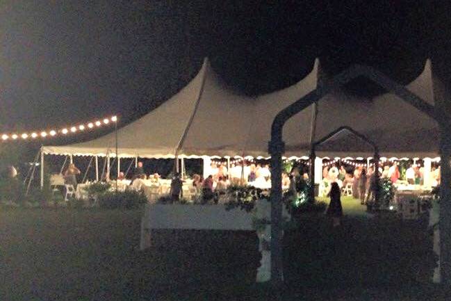 A recent wedding in Jasper, Alabama. Set up behind the customer's house, our tents, tables, chairs and lights made for a great night wedding this summer.