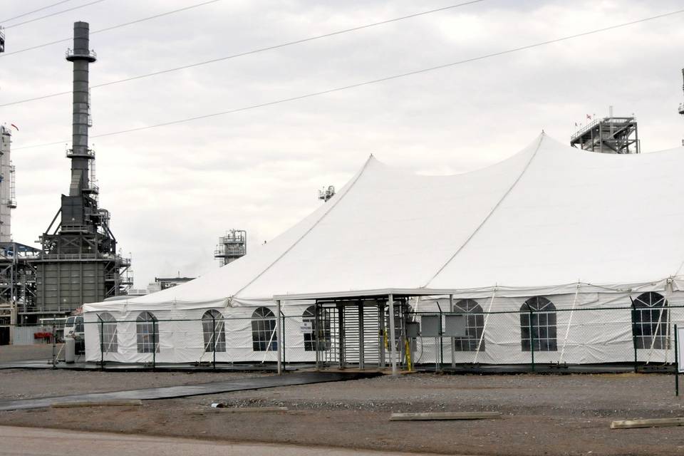 A pole tent set up for Hunt Refining.